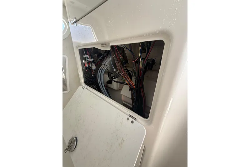 Slide: The Image of Open hatch showing wiring inside a 2021 Sea Fox 268 Commander boat. - 68