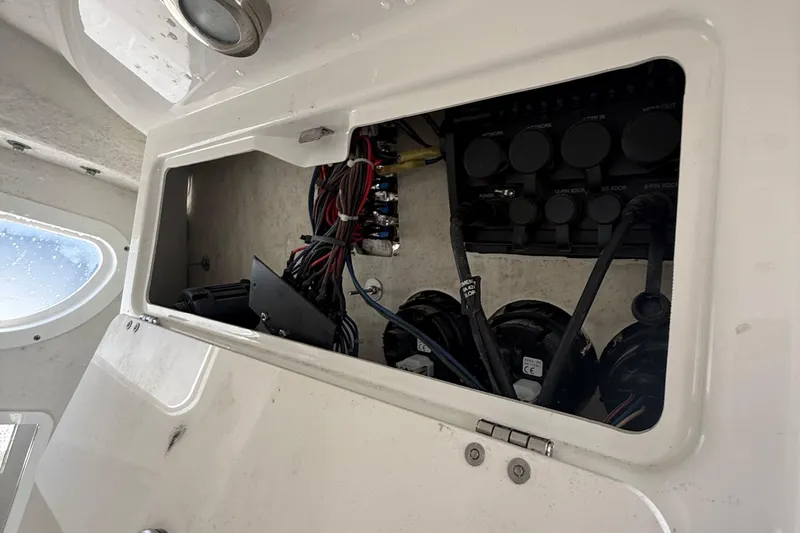 Slide: The Image of Electrical panel inside a 2021 Sea Fox 268 Commander boat, showing wiring and components. - 71