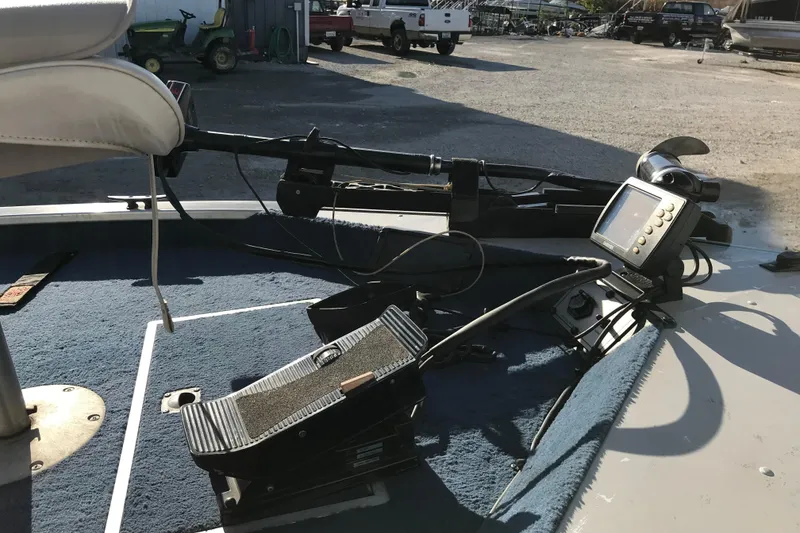 Slide: The Image of 1997 Lowe Bass Striker 170 boat deck with trolling motor and fish finder. - 8