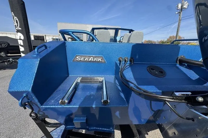 Slide: The Image of 2026 SeaArk Dynasty 2.0 boat, blue exterior, rear view with brand logo. - 12