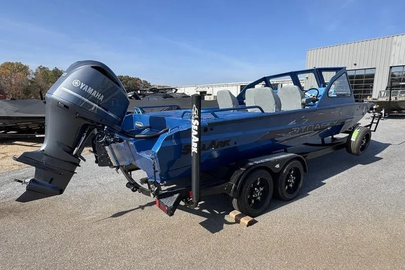 Slide: The Image of 2026 SeaArk Dynasty 2.0 boat with Yamaha motor on trailer, outdoors. - 16