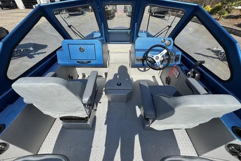 Slide: The Image of Interior of 2026 SeaArk Dynasty 2.0 boat with modern seating and control panel. - 25