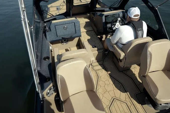 Slide: The Image of 2026 SeaArk Dynasty 2.0 boat interior with beige seating and modern dashboard. - 40