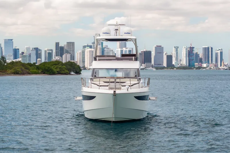 Slide: The Image of 2020 Galeon 500 Fly yacht cruising near city skyline on a sunny day. - 10