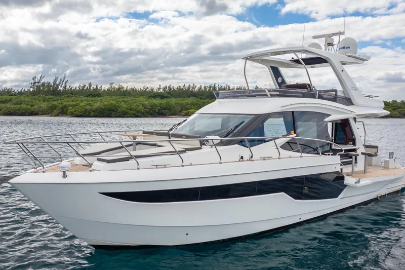 Slide: The Image of 2020 Galeon 500 Fly yacht on water, featuring sleek design and modern architecture. - 11