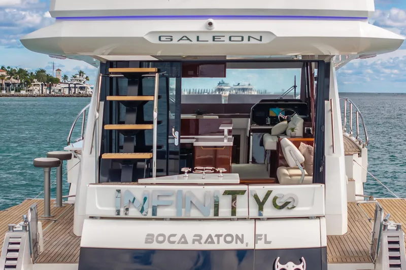 Slide: The Image of 2020 Galeon 500 Fly yacht docked in Boca Raton, Florida, with luxurious interior. - 12