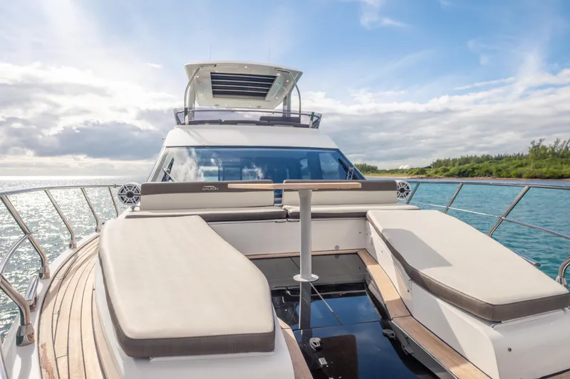 Slide: The Image of 2020 Galeon 500 Fly yacht with luxurious deck seating, cruising on a sunny day. - 17