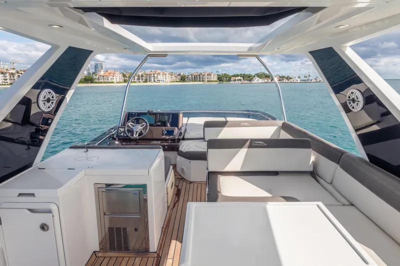 Slide: The Image of Luxurious 2020 Galeon 500 Fly yacht interior with modern seating and ocean view. - 18
