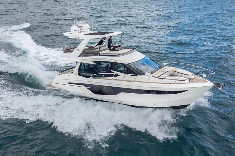 Slide: The Image of 2020 Galeon 500 Fly yacht cruising on open water. - 2