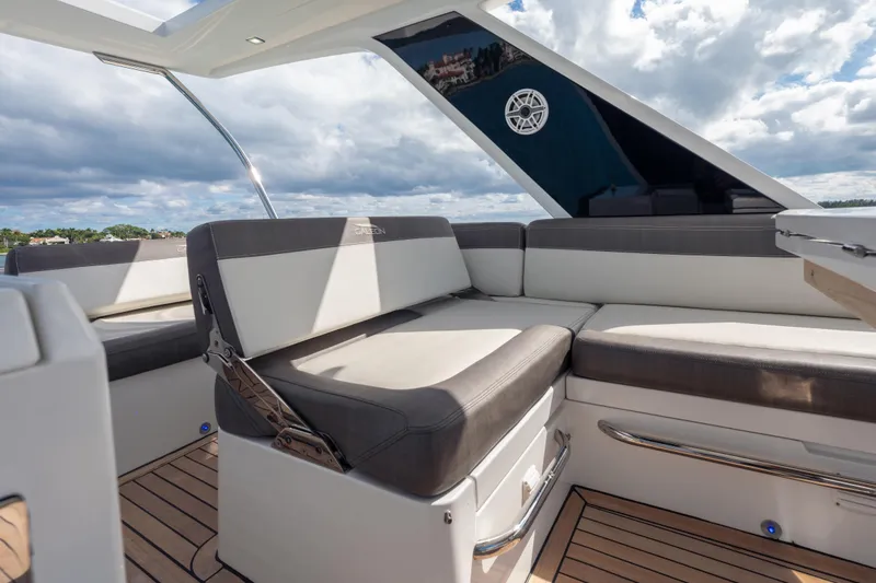 Slide: The Image of Luxurious seating area on 2020 Galeon 500 Fly yacht under a partly cloudy sky. - 23