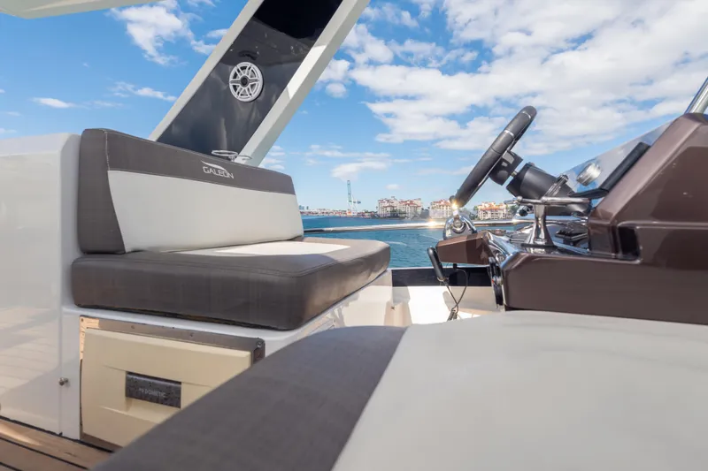 Slide: The Image of 2020 Galeon 500 Fly yacht helm with luxurious seating and ocean view. - 28