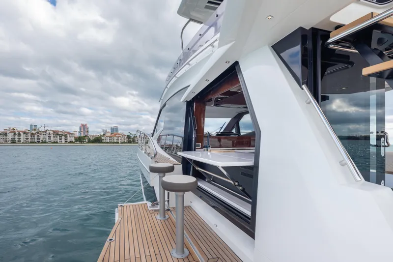 Slide: The Image of 2020 Galeon 500 Fly yacht with sleek design and waterfront view. - 30