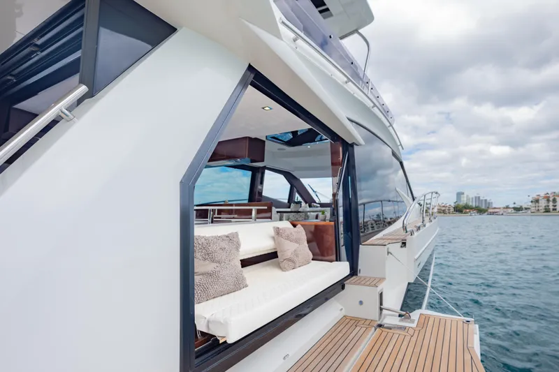 Slide: The Image of 2020 Galeon 500 Fly yacht with open deck, luxurious seating, and ocean view. - 32