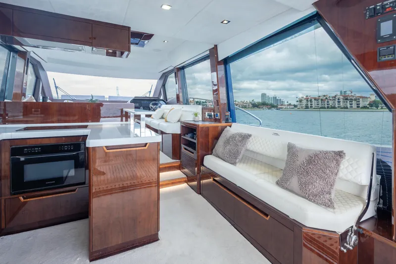 Slide: The Image of Luxurious interior of 2020 Galeon 500 Fly yacht with modern kitchen and seating area. - 34