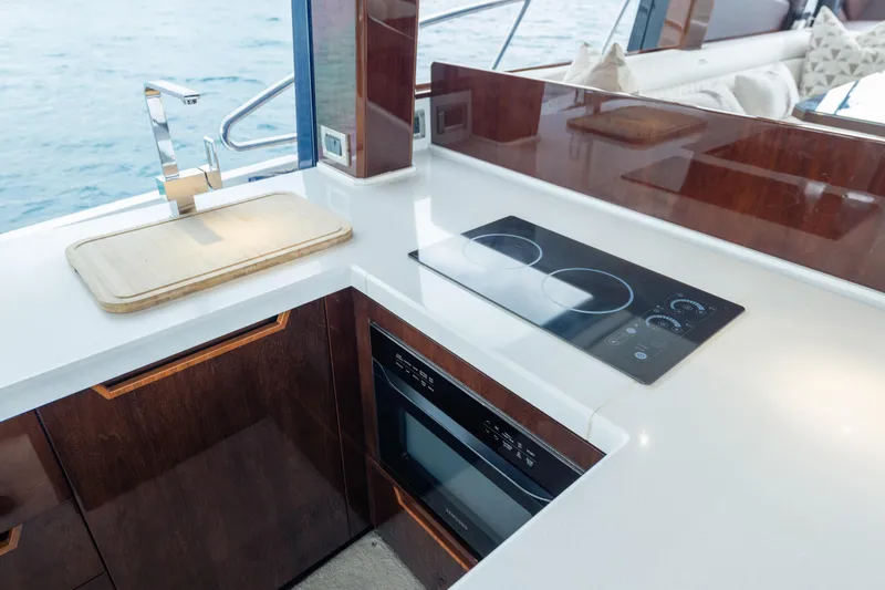 Slide: The Image of Modern kitchen on 2020 Galeon 500 Fly yacht with sleek appliances and ocean view. - 37