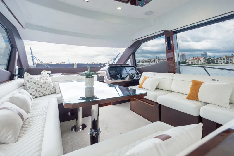 Slide: The Image of Luxurious interior of 2020 Galeon 500 Fly yacht with elegant seating and panoramic windows. - 41