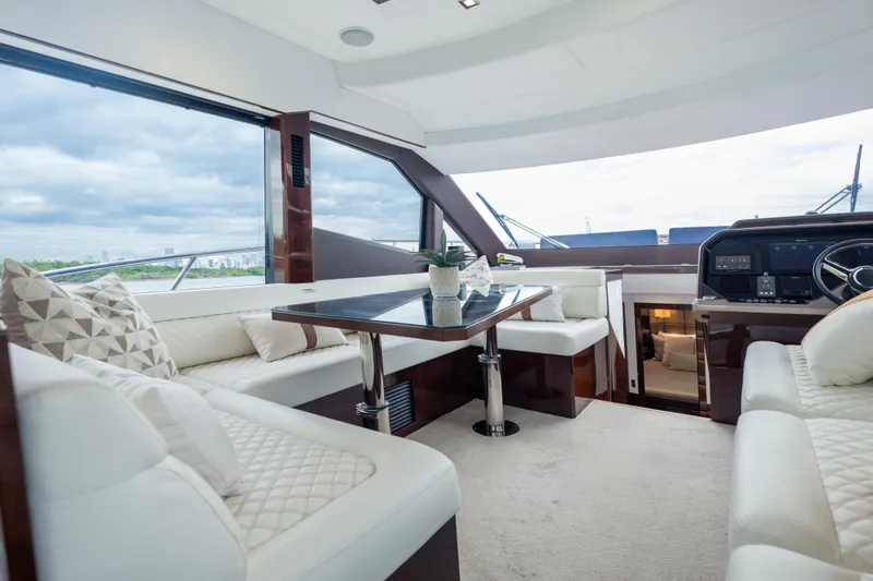 Slide: The Image of Luxurious interior of 2020 Galeon 500 Fly yacht with elegant seating and panoramic windows. - 42