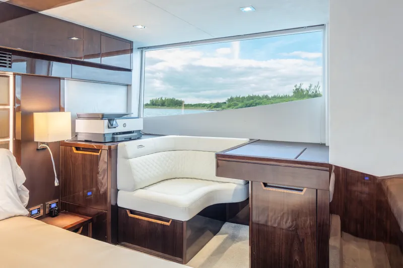 Slide: The Image of Luxurious interior of 2020 Galeon 500 Fly yacht with elegant seating and scenic window view. - 46