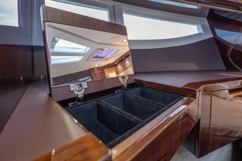 Slide: The Image of Luxurious interior of 2020 Galeon 500 Fly yacht with open storage compartment. - 48