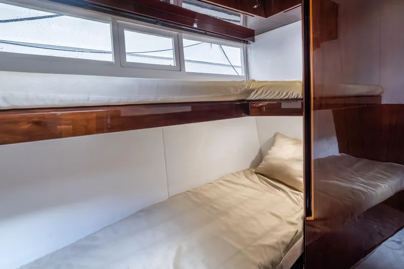 Slide: The Image of Interior cabin of 2020 Galeon 500 Fly yacht with bunk beds and wooden finishes. - 55