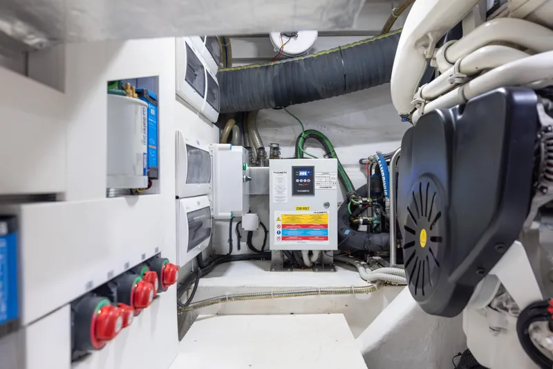 Slide: The Image of Engine room of 2020 Galeon 500 Fly yacht, showcasing electrical systems and components. - 57