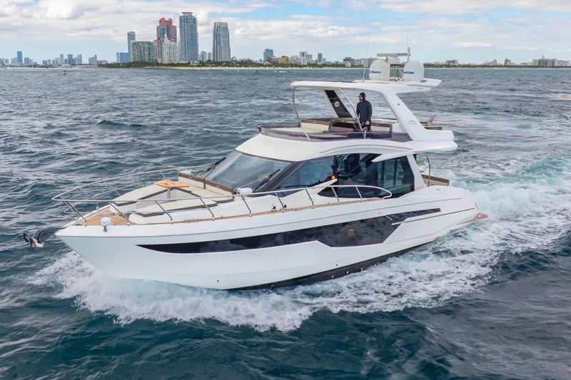 Slide: The Image of 2020 Galeon 500 Fly yacht cruising near city skyline on a sunny day. - 68