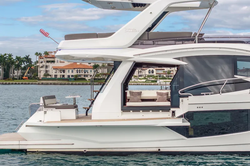 Slide: The Image of 2020 Galeon 500 Fly yacht on water, showcasing sleek design and luxurious features. - 8