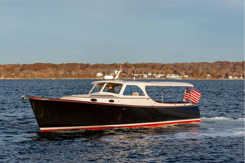 Slide: The Image of Interior of 2001 Hinckley Ya Picn boat with blue seating and ventilation detail. - 21