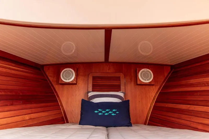 Slide: The Image of Luxurious cabin interior of 2001 Hinckley Ya Picn boat with wooden paneling. - 27