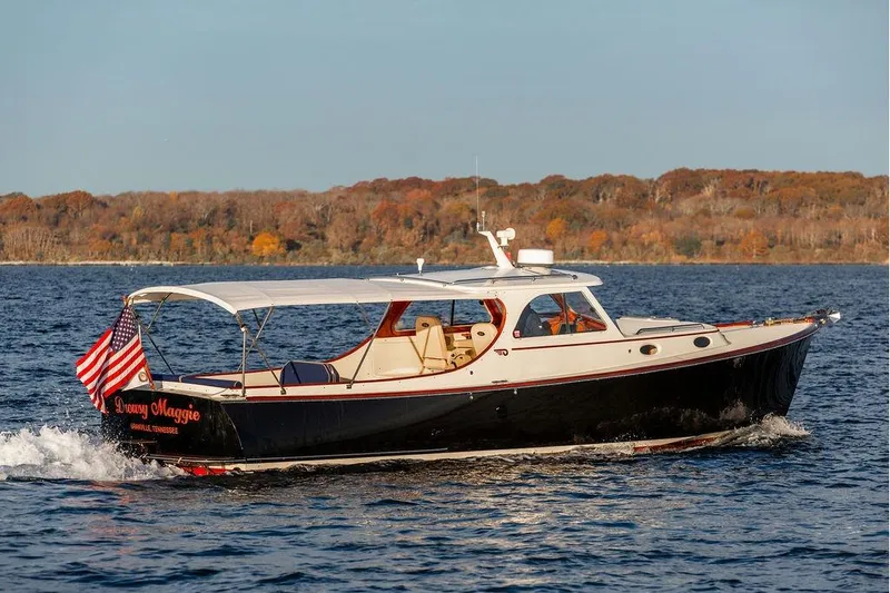 Slide: The Image of Hinckley Ya Picn 2001 boat named "Drowsy Maggie" on water, autumn shoreline in background. - 36