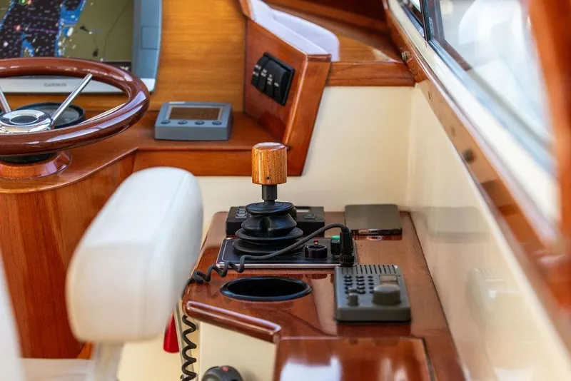 Slide: The Image of Hinckley Ya Picn 2001 boat helm with Garmin GPS and wooden steering wheel. - 8