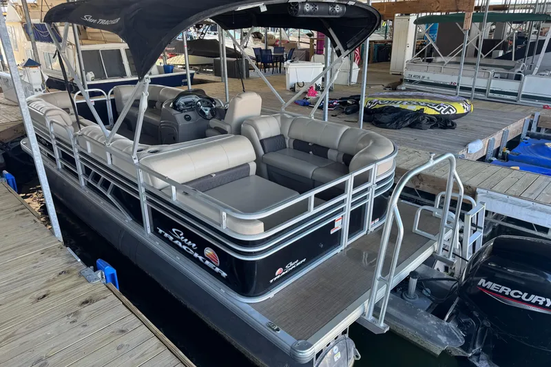 Slide: The Image of 2020 Sun Tracker Party Barge 22 DLX pontoon boat docked with Mercury outboard motor. - 5