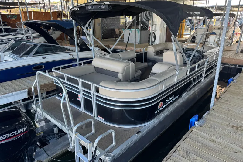 Slide: The Image of 2020 Sun Tracker Party Barge 22 DLX with spacious seating at a marina. - 7