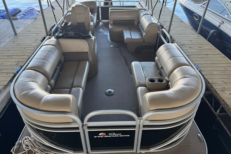 Slide: The Image of 2020 Sun Tracker Party Barge 22 DLX interior with plush seating and cup holders. - 9