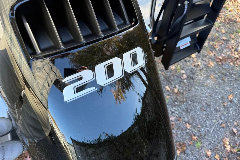 Slide: The Image of Close-up of a 200 horsepower engine on a 2026 Tahoe Pontoon LTZ Quad Lounger. - 4