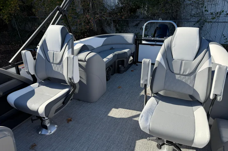 Slide: The Image of 2026 Tahoe Pontoon LTZ Quad Lounger interior with plush seating and modern design. - 7