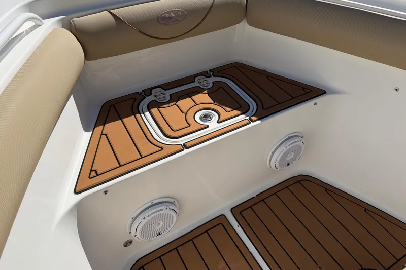Slide: The Image of 2018 Sea Hunt Gamefish 30 Coffin Box interior with cushioned seating and marine speakers. - 12