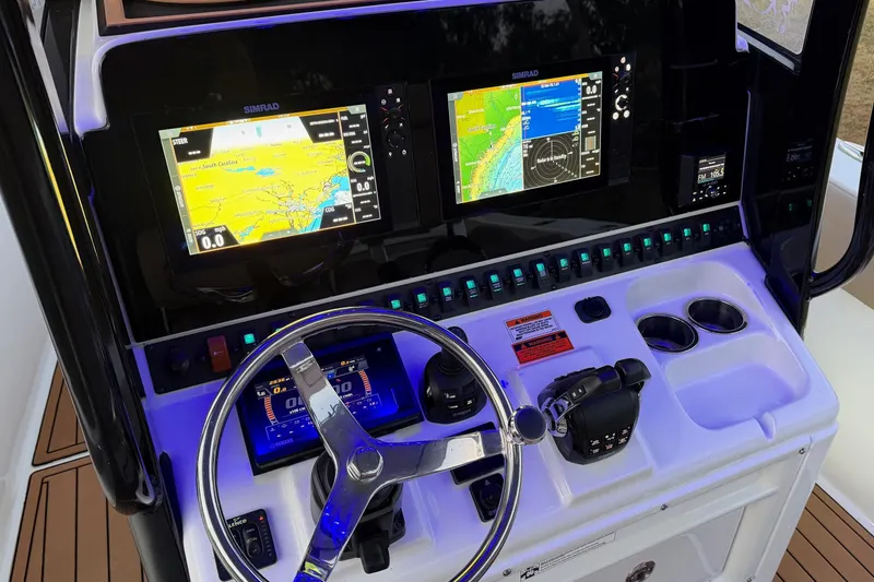 Slide: The Image of 2018 Sea Hunt Gamefish 30 Coffin Box dashboard with navigation screens and controls. - 16
