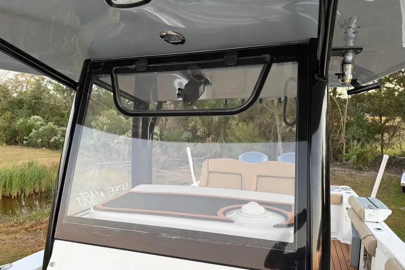 Slide: The Image of 2018 Sea Hunt Gamefish 30 Coffin Box boat interior with seating and console view. - 19