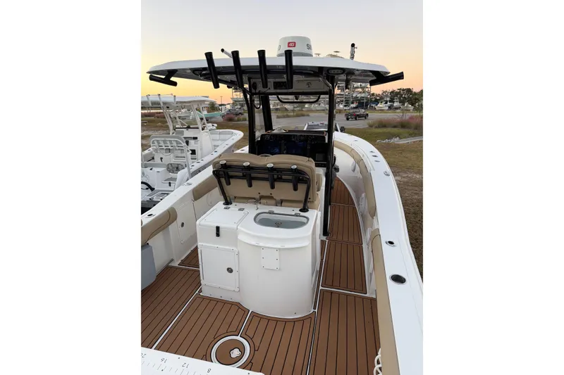 Slide: The Image of 2018 Sea Hunt Gamefish 30 Coffin Box boat with teak deck and fishing equipment. - 22