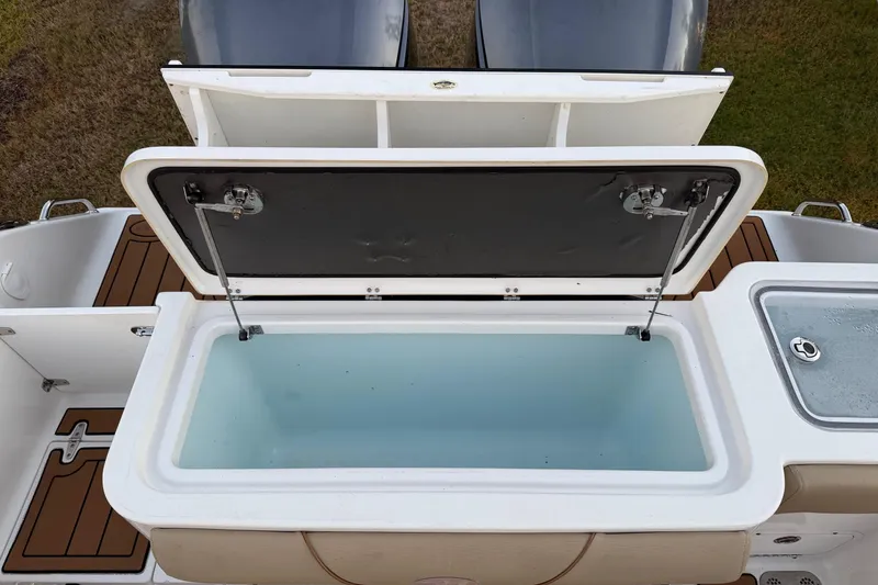 Slide: The Image of 2018 Sea Hunt Gamefish 30 Coffin Box with open storage compartment on deck. - 27