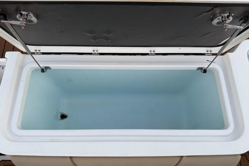 Slide: The Image of Open coffin box on 2018 Sea Hunt Gamefish 30, showcasing spacious interior. - 28