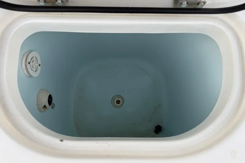 Slide: The Image of 2018 Sea Hunt Gamefish 30 Coffin Box interior, showing clean, empty storage compartment. - 32