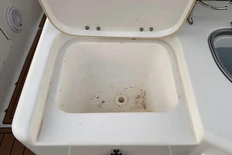 Slide: The Image of Open storage compartment on 2018 Sea Hunt Gamefish 30 Coffin Box boat. - 33