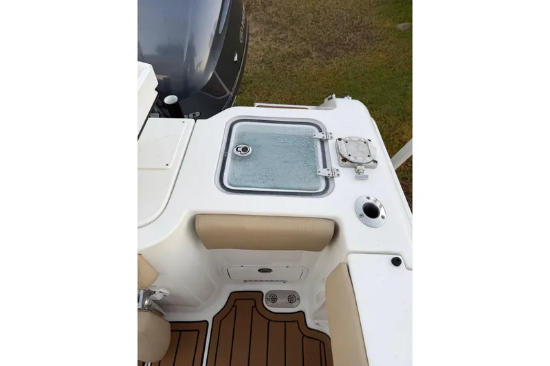 Slide: The Image of 2018 Sea Hunt Gamefish 30 Coffin Box boat interior with storage compartment and seating. - 34