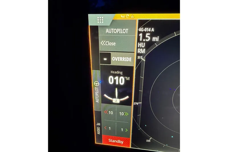 Slide: The Image of Autopilot display on 2018 Sea Hunt Gamefish 30 Coffin Box, showing heading and radar. - 38