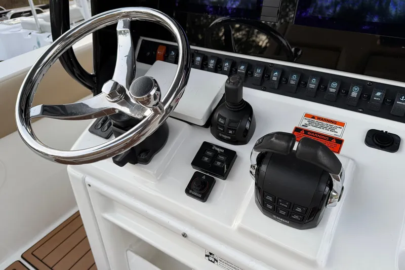 Slide: The Image of Control panel of 2018 Sea Hunt Gamefish 30 Coffin Box boat with steering wheel. - 39