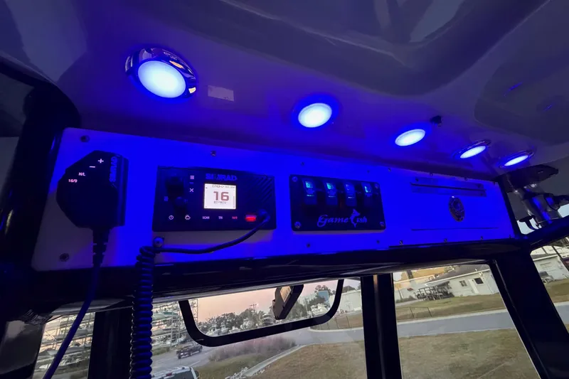Slide: The Image of 2018 Sea Hunt Gamefish 30 Coffin Box dashboard with blue LED lights and control panel. - 44