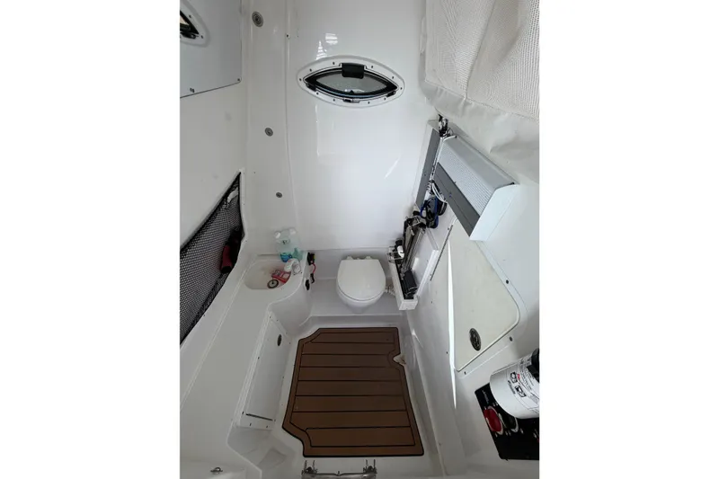 Slide: The Image of 2018 Sea Hunt Gamefish 30 Coffin Box interior with toilet and storage features. - 52