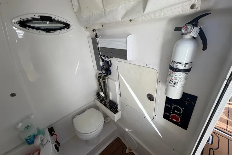 Slide: The Image of Interior of 2018 Sea Hunt Gamefish 30 Coffin Box with toilet and fire extinguisher. - 53